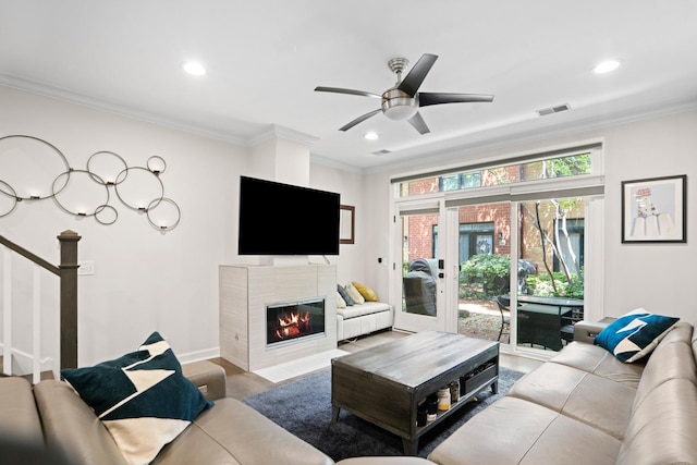 1801 W Diversey Pkwy Unit 36, Chicago, IL 60614 - living area featuring ceiling fan, crown molding, recessed lighting, a tiled fireplace, and wood finished floors