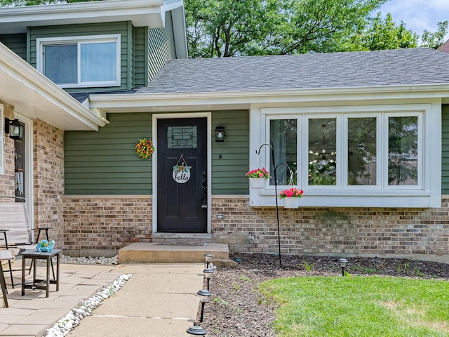 7559 Kingsbury Dr, Hanover Park, IL 60133 - property entrance featuring brick siding and roof with shingles