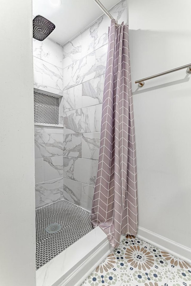 7559 Kingsbury Dr, Hanover Park, IL 60133 - bathroom featuring a stall shower and tile patterned flooring