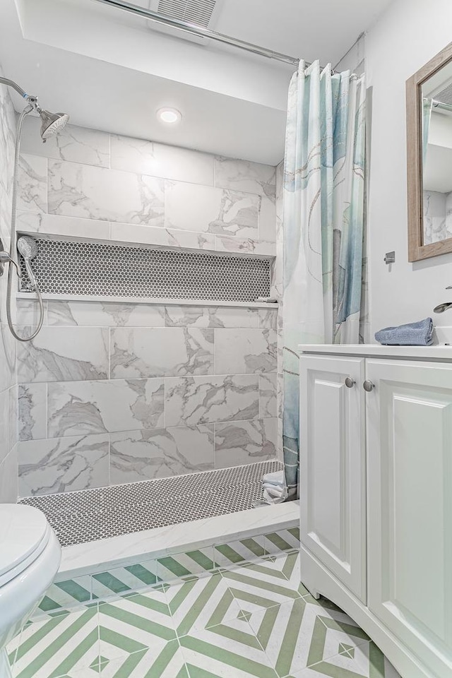 7559 Kingsbury Dr, Hanover Park, IL 60133 - full bathroom featuring a stall shower and vanity
