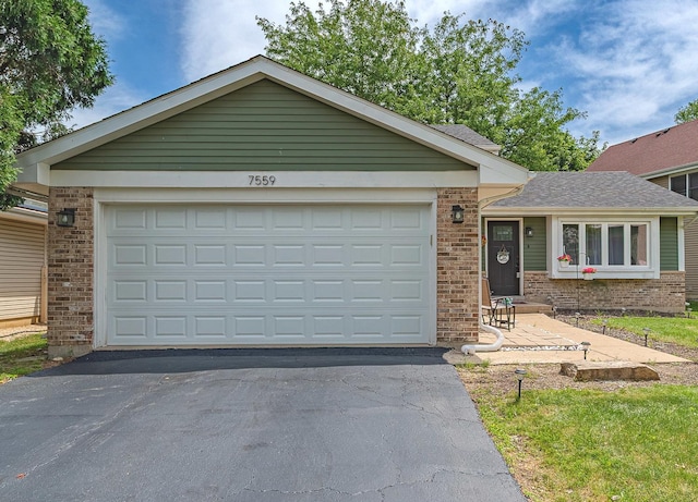 7559 Kingsbury Dr, Hanover Park, IL 60133 - ranch-style house with brick siding, driveway, and a garage