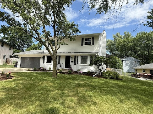 3814 Abbotsford Rd, Rockford, IL 61107 - traditional-style house with a chimney, an attached garage, and driveway
