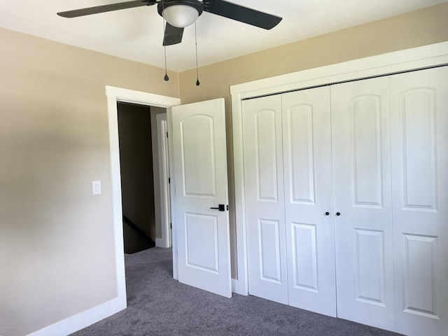 3814 Abbotsford Rd, Rockford, IL 61107 - unfurnished bedroom with dark carpet, a closet, and a ceiling fan