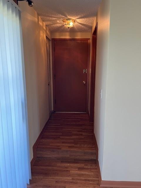 291 Gregory St Unit 6, Aurora, IL 60504 - corridor featuring wood finished floors and a textured ceiling