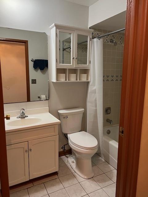 291 Gregory St Unit 6, Aurora, IL 60504 - bathroom with vanity, shower / tub combo, and tile patterned floors
