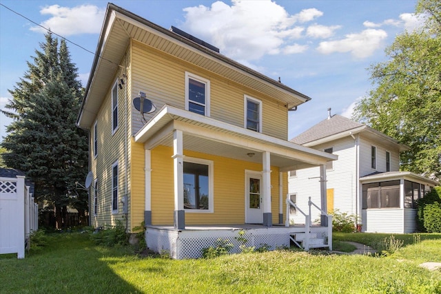 1304 E 4th St, Sterling, IL 61081 - american foursquare style home with a porch and a sunroom