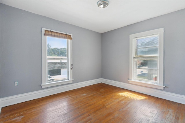 1304 E 4th St, Sterling, IL 61081 - spare room with hardwood / wood-style floors and baseboards