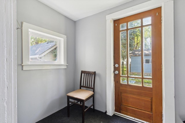 1304 E 4th St, Sterling, IL 61081 - doorway featuring plenty of natural light and dark carpet