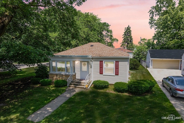 393 Lakelawn Blvd, Aurora, IL 60506 - bungalow-style house with a lawn and a shingled roof