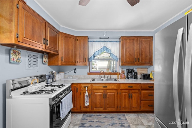 393 Lakelawn Blvd, Aurora, IL 60506 - kitchen featuring white range with gas stovetop, freestanding refrigerator, brown cabinets, and light countertops