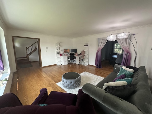 1970 Division St, Saint Charles, IL 60174 - living room featuring a desk, wood finished floors, crown molding, and stairs