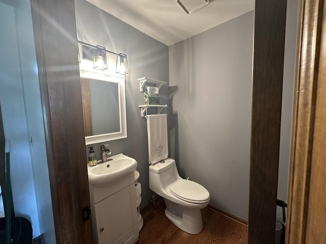 1970 Division St, Saint Charles, IL 60174 - half bathroom featuring wood finished floors and vanity