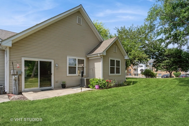 2501 Park Ridge Ct Unit 2501, Crest Hill, IL 60403 - back of house with a lawn, a patio, and roof with shingles