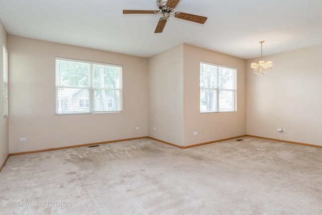 2501 Park Ridge Ct Unit 2501, Crest Hill, IL 60403 - carpeted empty room with a chandelier and ceiling fan