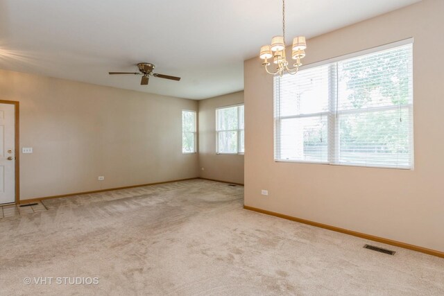 2501 Park Ridge Ct Unit 2501, Crest Hill, IL 60403 - carpeted empty room featuring a ceiling fan and a chandelier