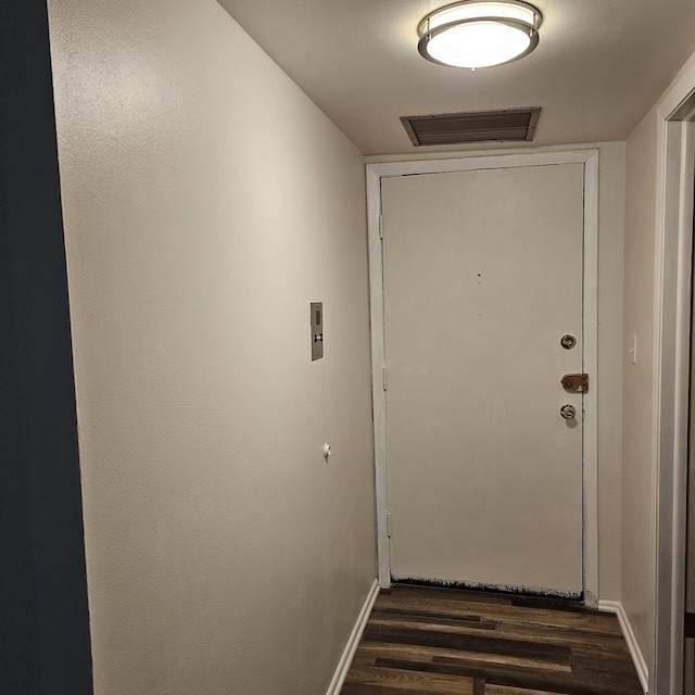 6959 N Ridge Blvd Unit 1C, Chicago, IL 60645 - entryway with dark wood-style floors and baseboards