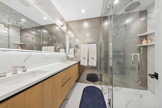 1825 N Halsted St Unit 2, Chicago, IL 60614 - bathroom featuring a marble finish shower, double vanity, and tile walls