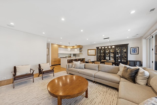 1825 N Halsted St Unit 2, Chicago, IL 60614 - living room featuring recessed lighting, ornamental molding, and light wood-style floors