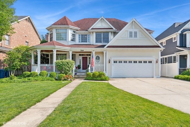 366 W Eggleston Ave, Elmhurst, IL 60126 - victorian-style house with driveway, covered porch, and a front lawn