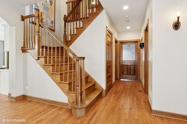 366 W Eggleston Ave, Elmhurst, IL 60126 - stairway featuring wood finished floors, arched walkways, and recessed lighting