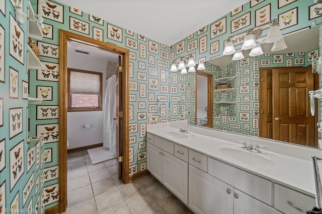 366 W Eggleston Ave, Elmhurst, IL 60126 - bathroom with wallpapered walls, double vanity, tile patterned flooring, and a chandelier