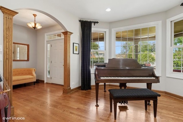 366 W Eggleston Ave, Elmhurst, IL 60126 - entryway featuring arched walkways, ornate columns, light wood-type flooring, and recessed lighting