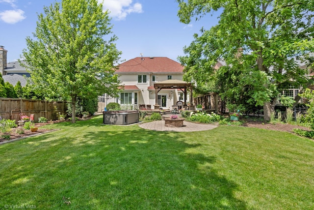 366 W Eggleston Ave, Elmhurst, IL 60126 - rear view of house featuring a gazebo, a hot tub, a fenced backyard, a patio, and a fire pit