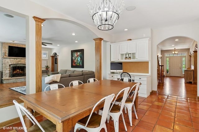 366 W Eggleston Ave, Elmhurst, IL 60126 - dining area with arched walkways, a fireplace, light tile patterned floors, ceiling fan, and recessed lighting
