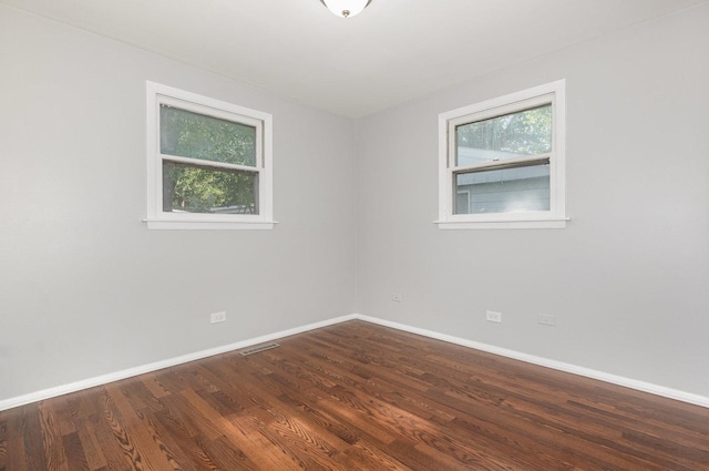213 Brierhill Dr, Round Lake Park, IL 60073 - unfurnished room featuring baseboards and dark wood-style floors