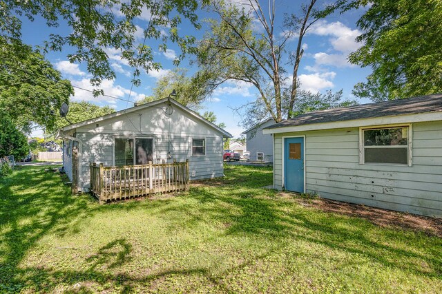 213 Brierhill Dr, Round Lake Park, IL 60073 - rear view of property featuring a lawn and a wooden deck