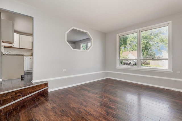 213 Brierhill Dr, Round Lake Park, IL 60073 - unfurnished living room featuring dark wood-type flooring and baseboards