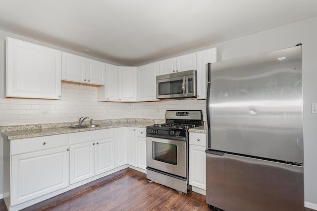 213 Brierhill Dr, Round Lake Park, IL 60073 - kitchen with appliances with stainless steel finishes, dark wood finished floors, white cabinets, and tasteful backsplash