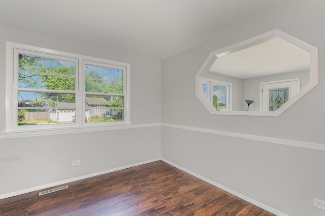 213 Brierhill Dr, Round Lake Park, IL 60073 - empty room featuring baseboards and dark wood-style flooring