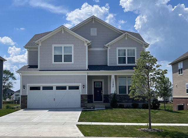 12490 Rossaveal Way, Lemont, IL 60439 - craftsman inspired home with driveway, an attached garage, a front yard, and stone siding