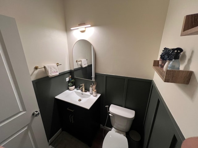12490 Rossaveal Way, Lemont, IL 60439 - half bathroom featuring vanity, a decorative wall, and a wainscoted wall