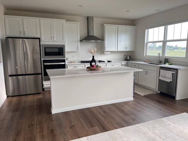 12490 Rossaveal Way, Lemont, IL 60439 - kitchen featuring stainless steel appliances, wall chimney range hood, a center island, white cabinets, and recessed lighting
