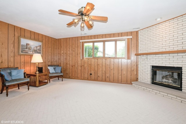 15309 S 73rd Ave Unit 15309, Orland Park, IL 60462 - living area with a brick fireplace, carpet flooring, wooden walls, and a ceiling fan