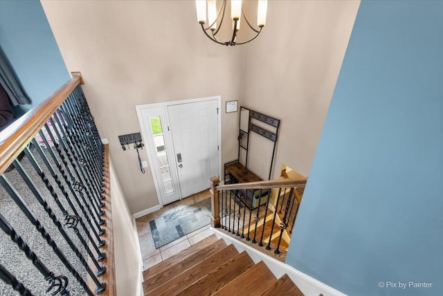 26 W Pine Ave, Cortland, IL 60112 - entrance foyer featuring a chandelier, stairs, a towering ceiling, and tile patterned floors