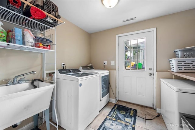 26 W Pine Ave, Cortland, IL 60112 - laundry area with washer and dryer and light tile patterned flooring