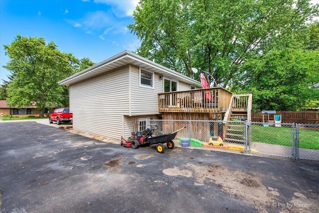 26 W Pine Ave, Cortland, IL 60112 - view of property exterior with a wooden deck, stairway, and a gate