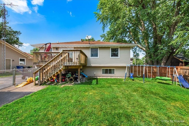 26 W Pine Ave, Cortland, IL 60112 - rear view of property featuring stairway, a wooden deck, a fenced backyard, and a playground