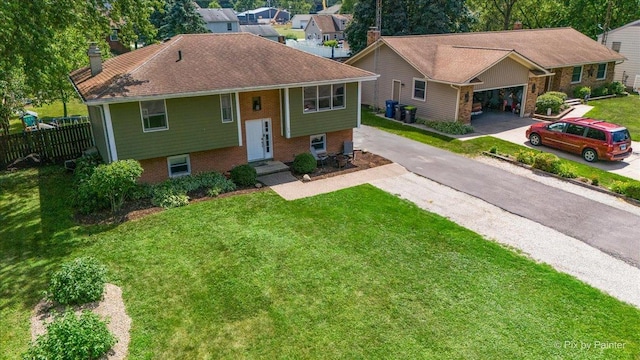26 W Pine Ave, Cortland, IL 60112 - bi-level home featuring a chimney, brick siding, and concrete driveway