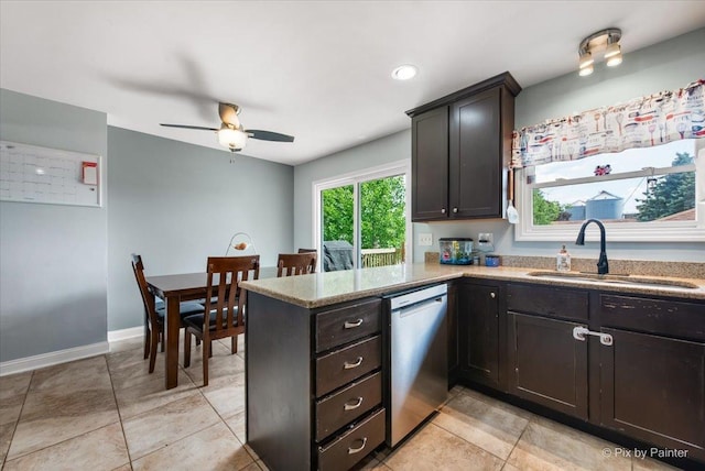 26 W Pine Ave, Cortland, IL 60112 - kitchen with dishwasher, a peninsula, light stone countertops, a ceiling fan, and light tile patterned floors