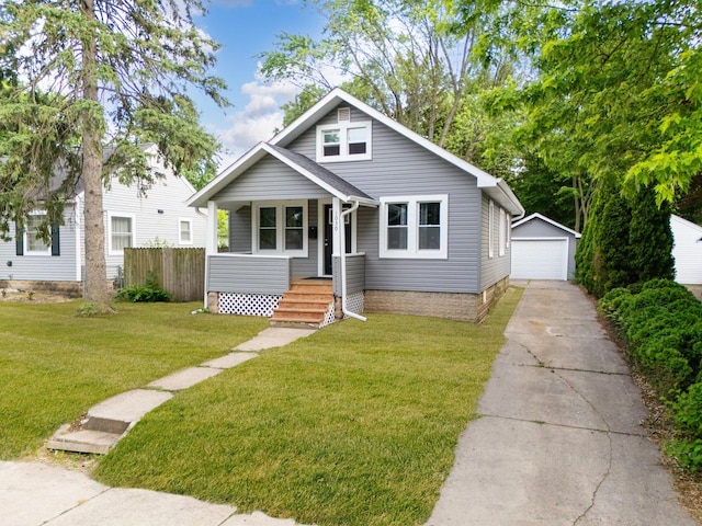 1030 Spruce St, Aurora, IL 60506 - bungalow featuring an outbuilding, a detached garage, and a porch