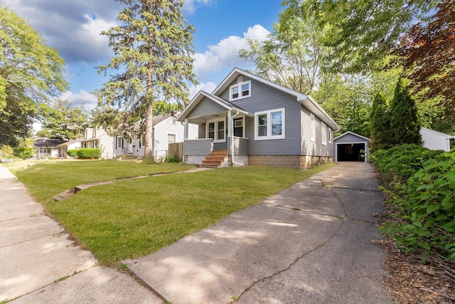 1030 Spruce St, Aurora, IL 60506 - bungalow featuring driveway, an outbuilding, a front yard, a detached garage, and a porch