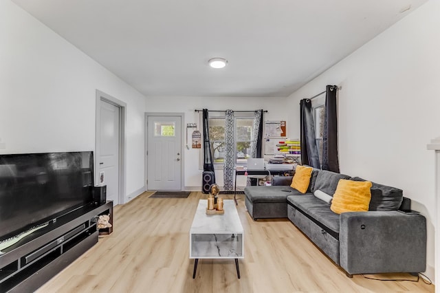 1030 Spruce St, Aurora, IL 60506 - living room with light wood-style floors and baseboards
