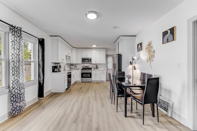 1030 Spruce St, Aurora, IL 60506 - dining space featuring light wood-style floors and baseboards