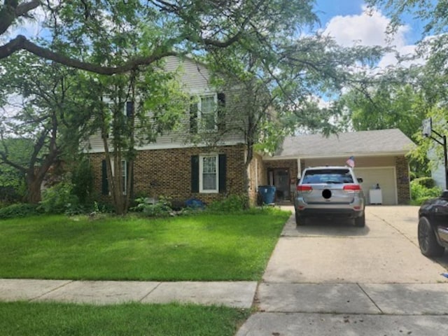 321 Carmelhead Ln, Schaumburg, IL 60193 - view of front of house featuring an attached garage, brick siding, a front lawn, and concrete driveway