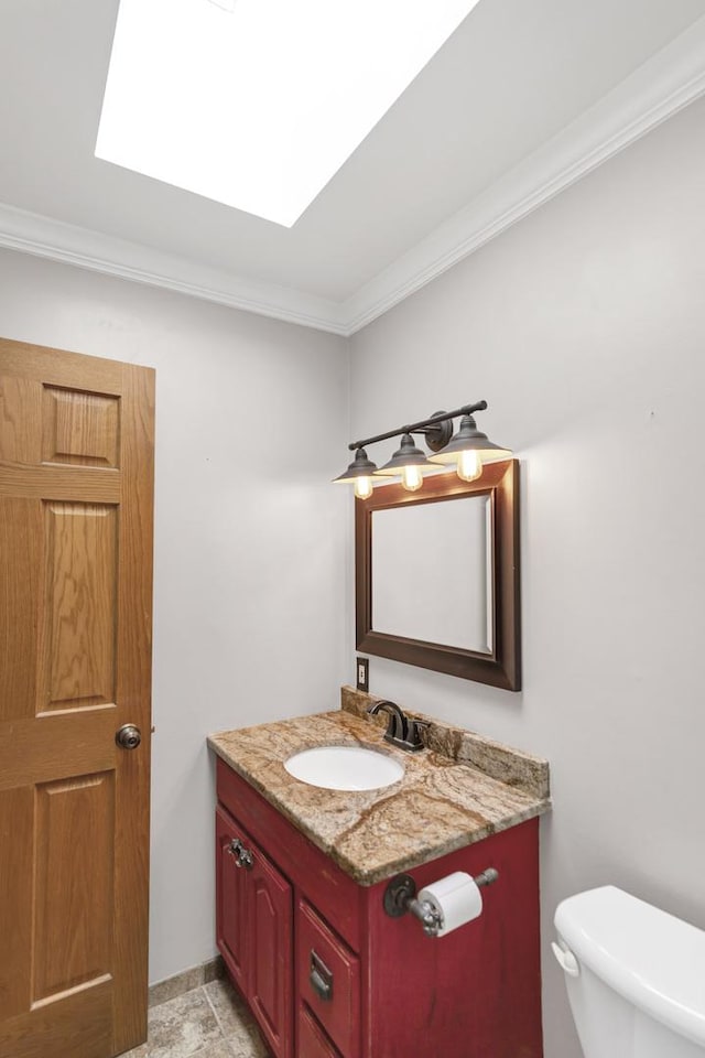 7 Walnut Dr, North Aurora, IL 60542 - half bathroom featuring vanity, ornamental molding, and a skylight