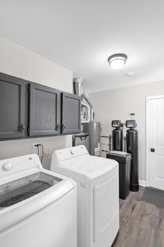 7 Walnut Dr, North Aurora, IL 60542 - laundry room with washing machine and clothes dryer, gas water heater, cabinet space, and wood finished floors